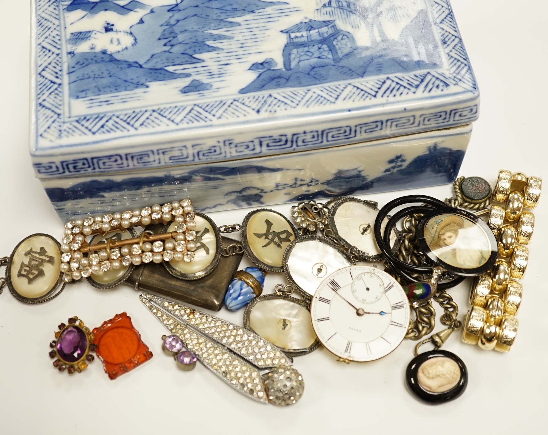 A quantity of assorted costume jewellery and watch movements.